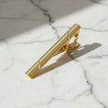 Krawattenklammer in glänzendem Gold CrystalScents