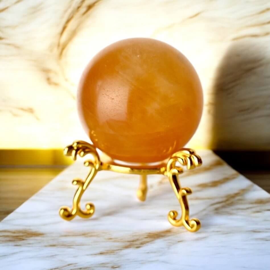 Kugel aus kräftig orangem Calcit – Stein für Energie und Vitalität