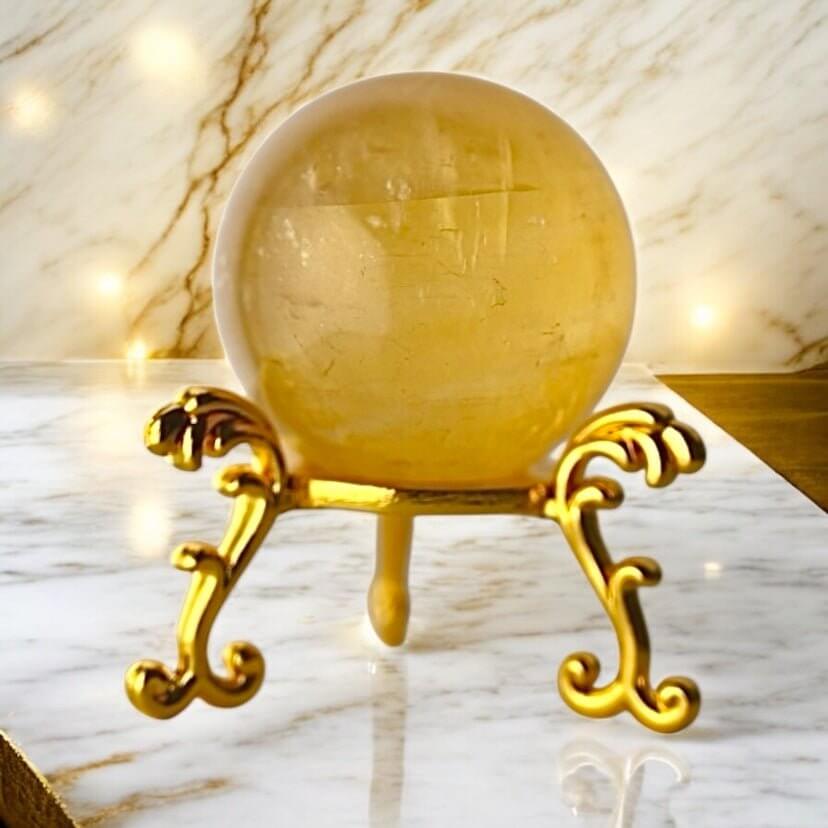 Strahlende Calcit Kugel in Orange – Symbol für Lebensfreude und Kreativität