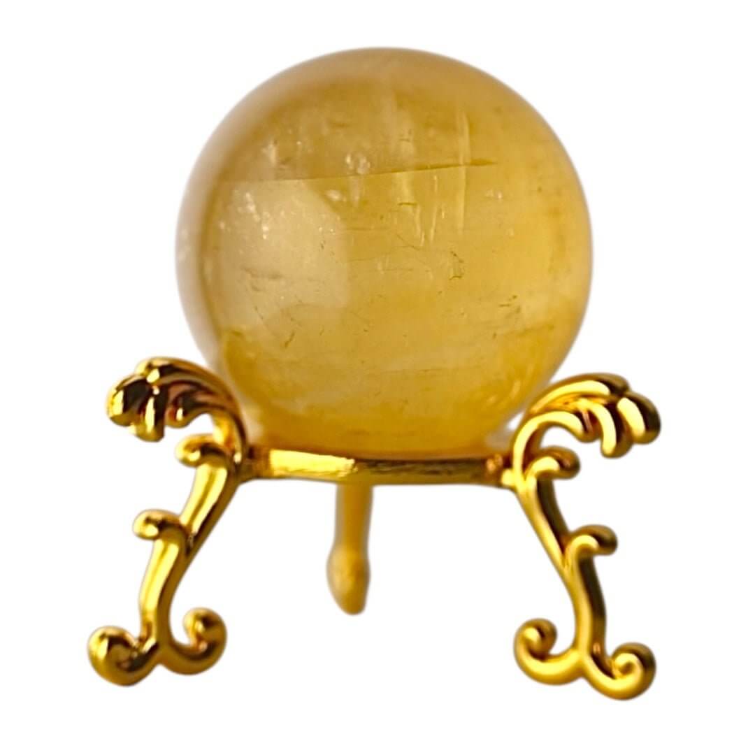 Strahlende Calcit Kugel in Orange – Symbol für Lebensfreude und Kreativität