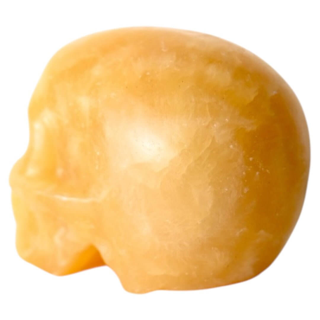 Oranger Calcit-Schädel – Kraftvolles Kristallobjekt für dekorative Akzente