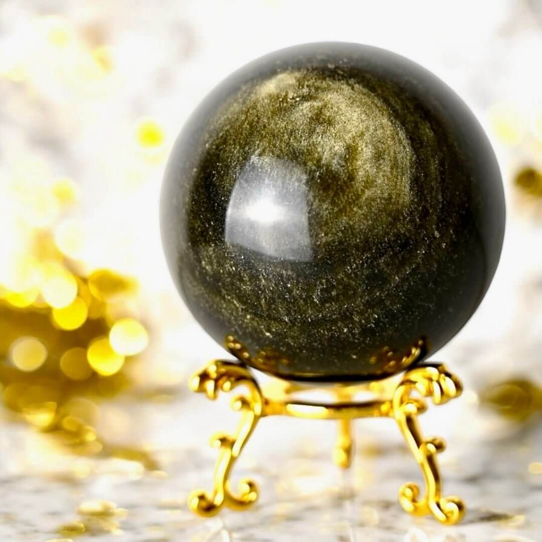 Gold Obsidian Kugel - Ein goldener Sternenhimmel in deiner Hand
