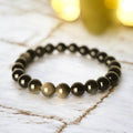Gold-Obsidian Kugelarmband – schützende Kraft in tiefem Schwarz mit goldenem Schimmer