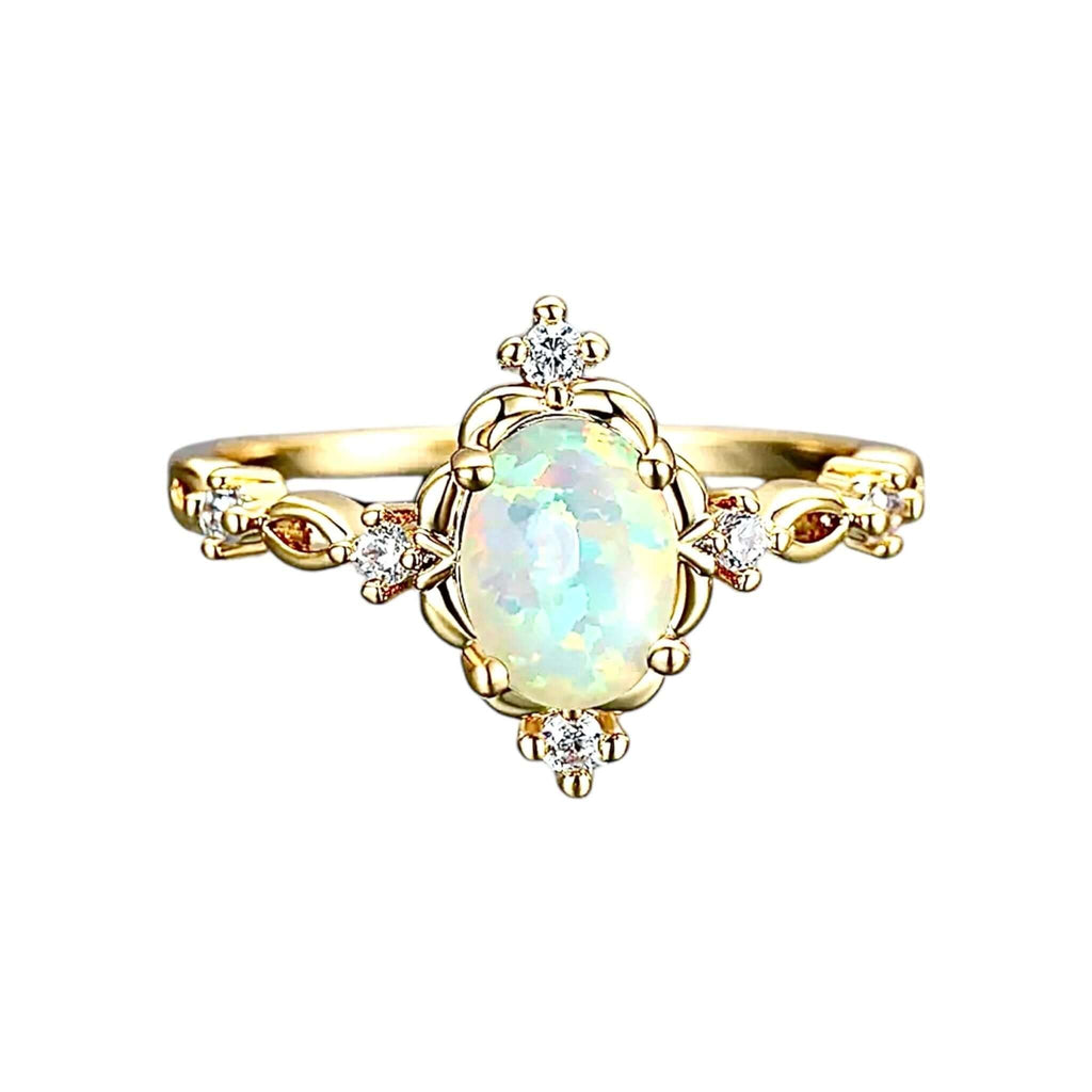 Goldener Ring mit umrahmtem Opal – elegantes Schmuckstück für leuchtende Akzente