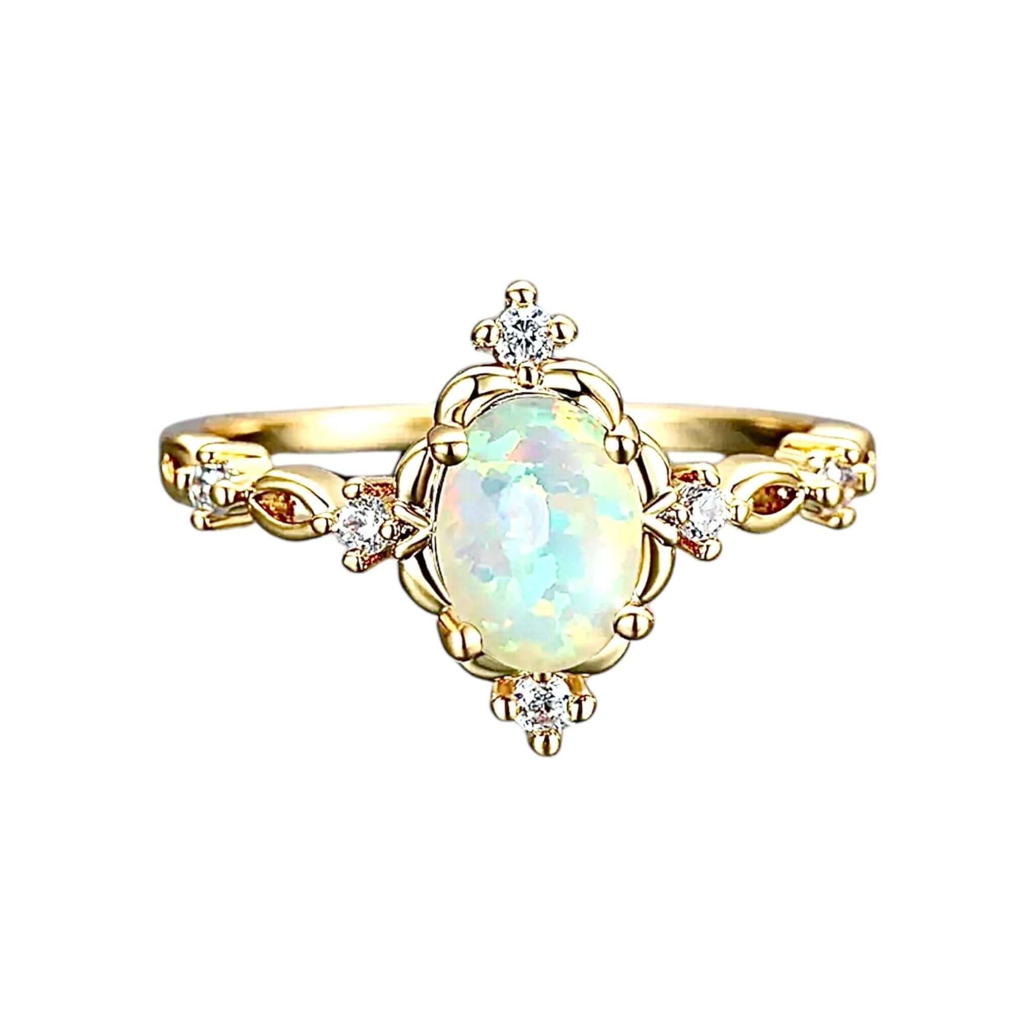 Goldener Ring mit umrahmtem Opal – elegantes Schmuckstück für leuchtende Akzente