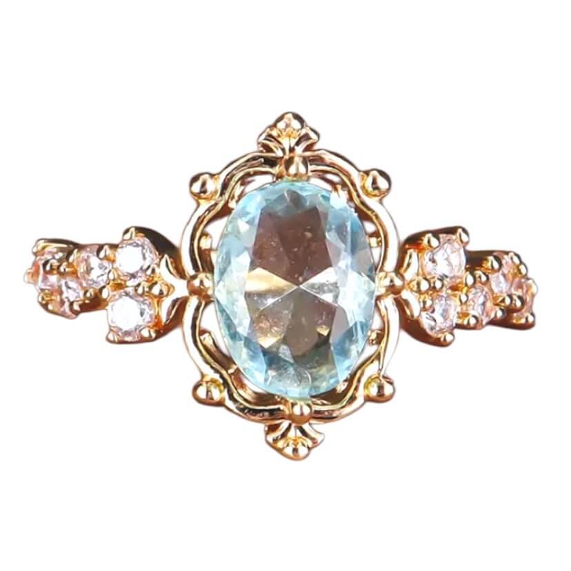Eleganter goldener Ring mit hellblauem Highlight