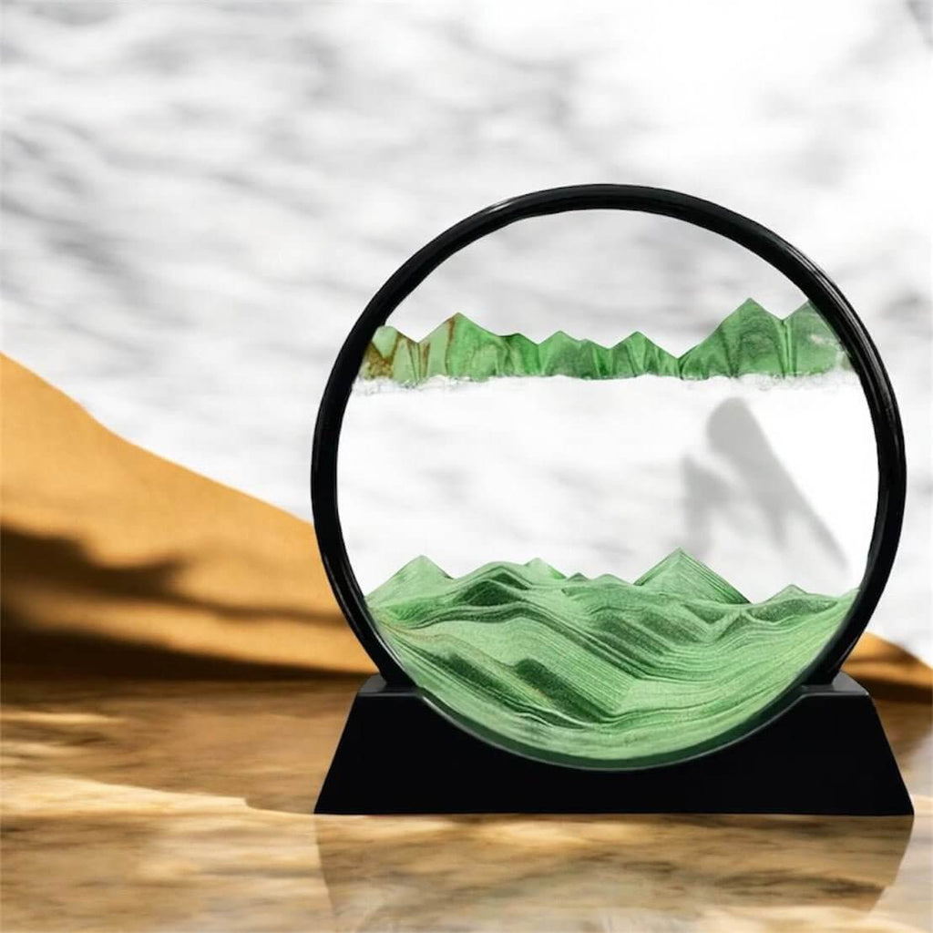 Sandbild in rundem schwarzen Rahmen Grün