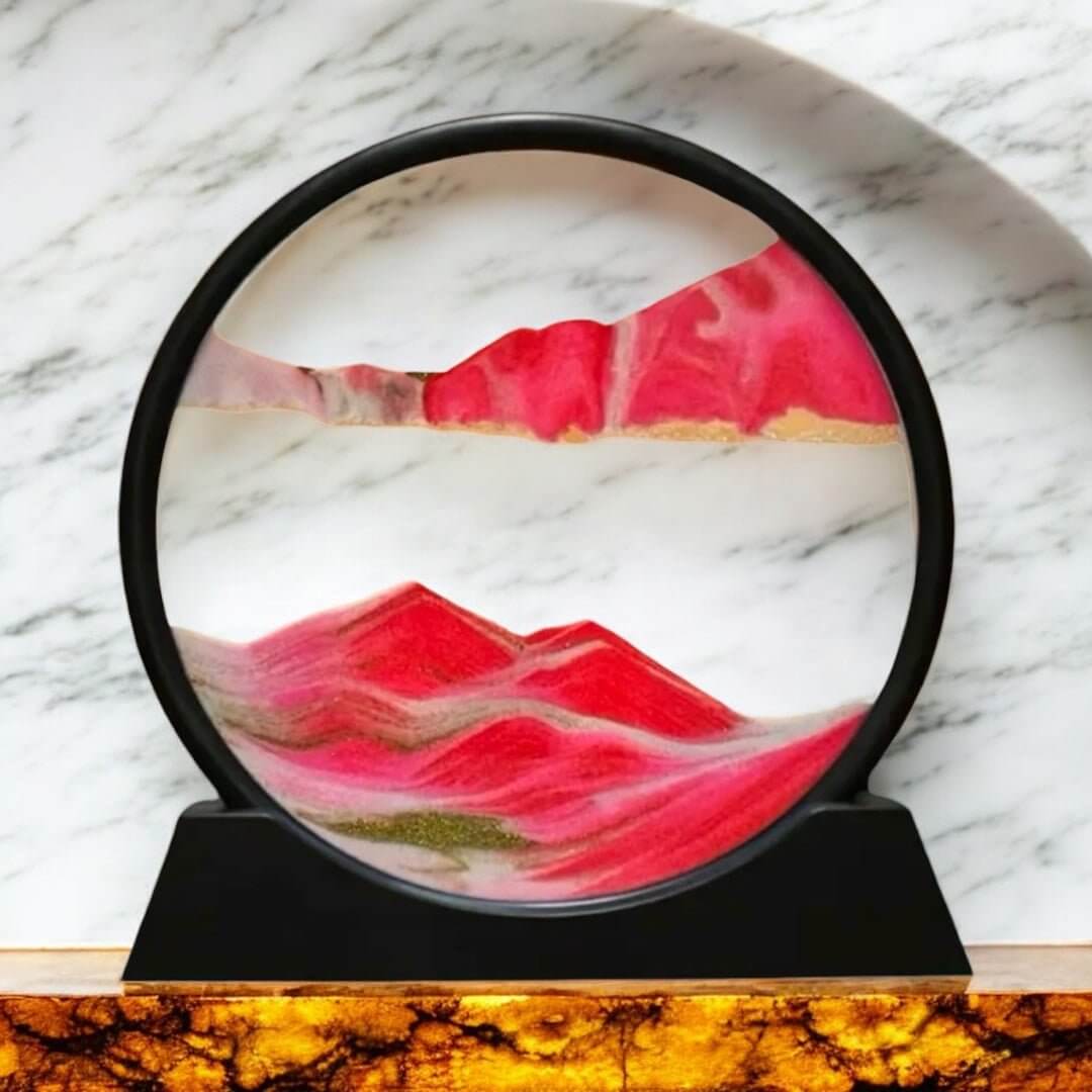 Sandbild in rundem schwarzen Rahmen Rot