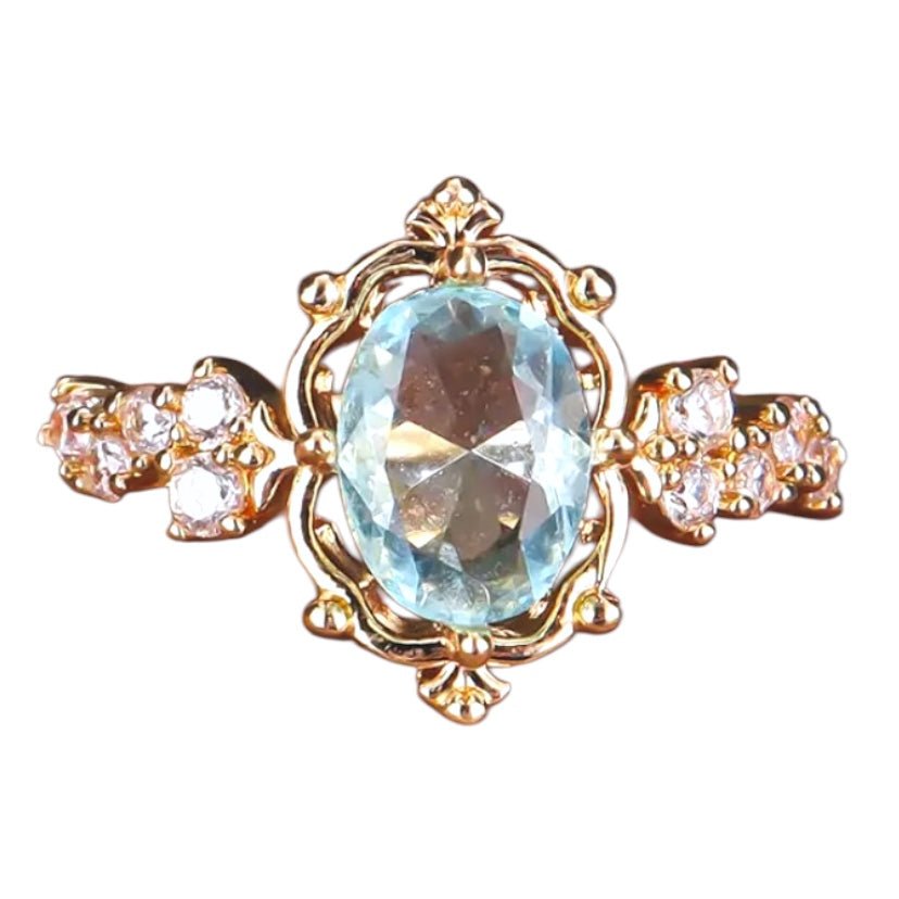 Eleganter goldener Ring mit hellblauem Zirkonia - CrystalScents