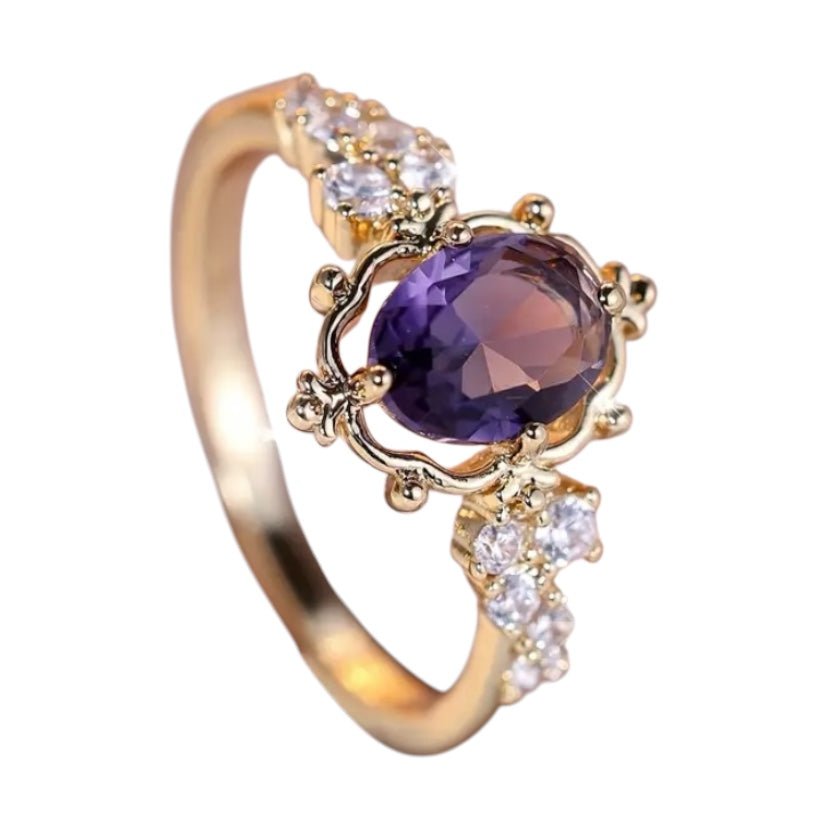 Eleganter goldener Ring mit lila Zirkonia - CrystalScents