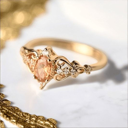Eleganter goldener Ring mit orangem Zirkonia - CrystalScents