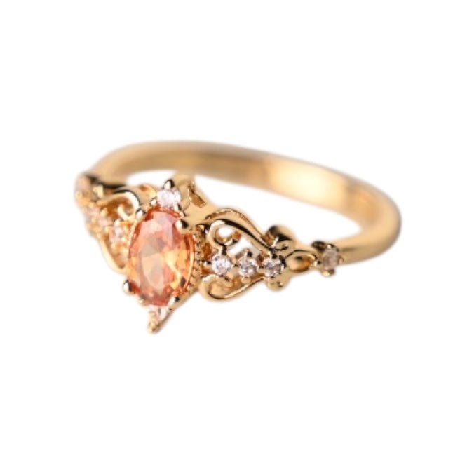 Eleganter goldener Ring mit orangem Zirkonia - CrystalScents