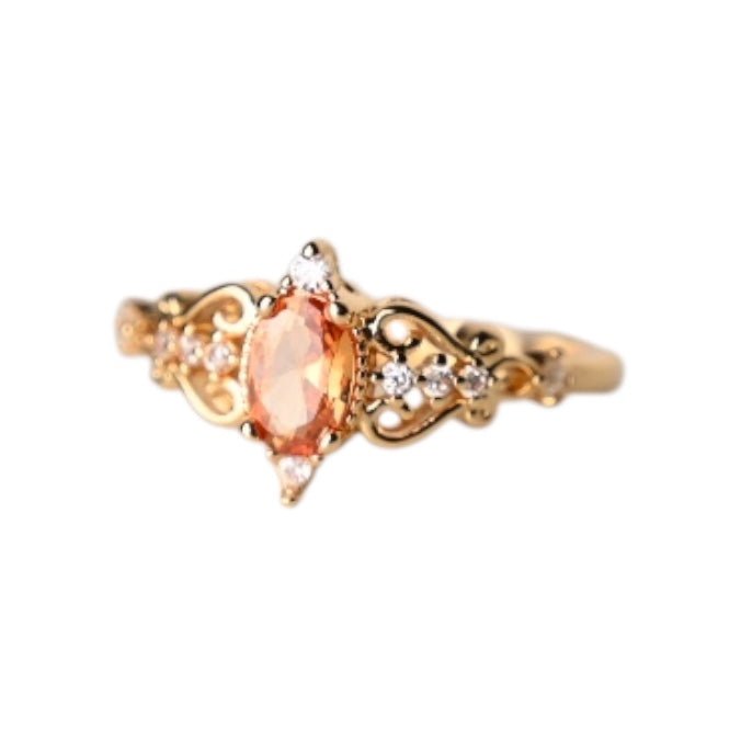 Eleganter goldener Ring mit orangem Zirkonia - CrystalScents