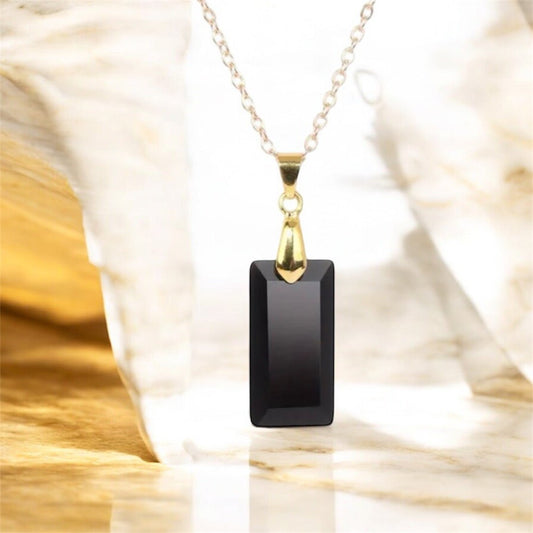 Goldene Kette mit geschliffenem schwarzen Achat - Anhänger - CrystalScents