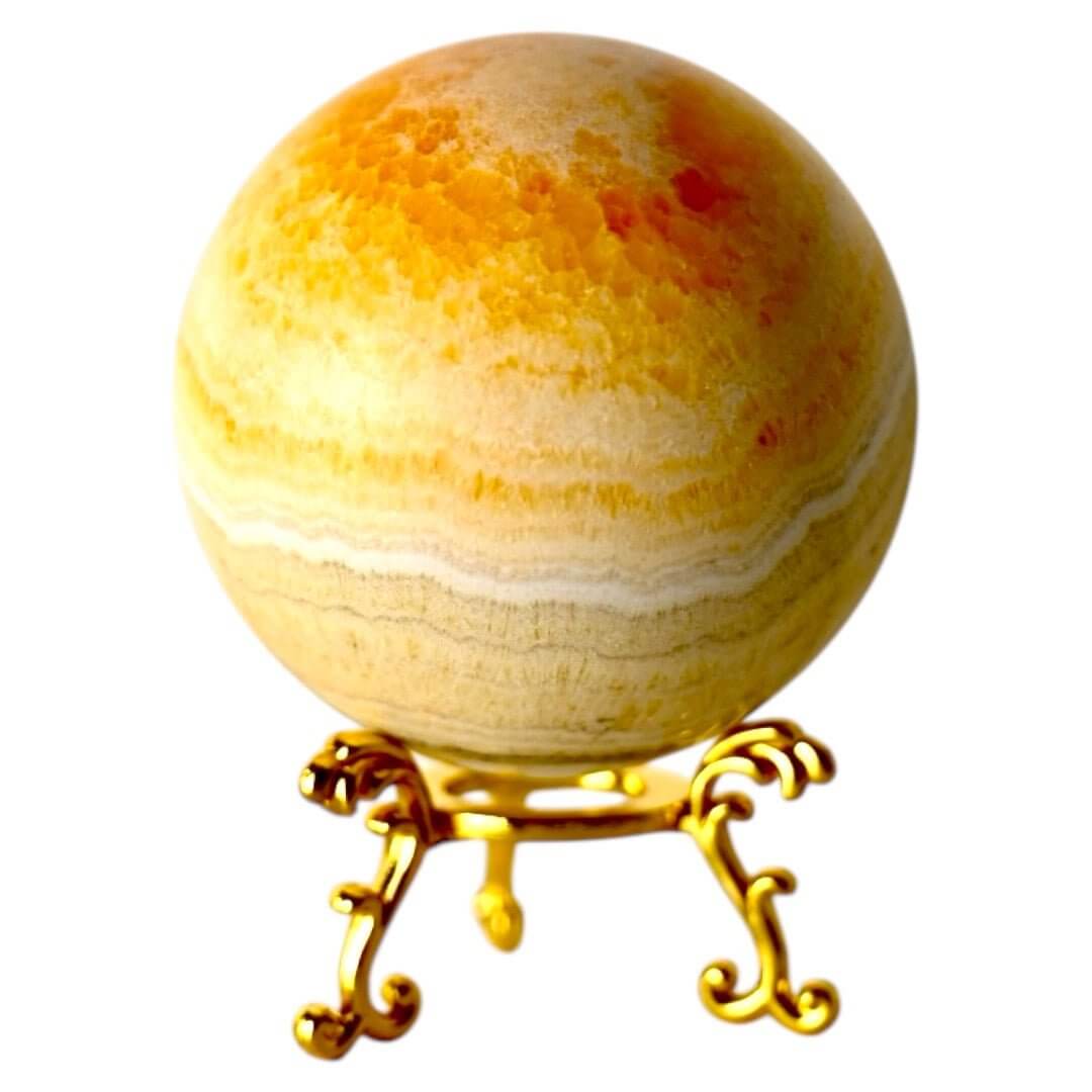 Strahlende Calcit Kugel in Orange – Symbol für Lebensfreude und Kreativität
